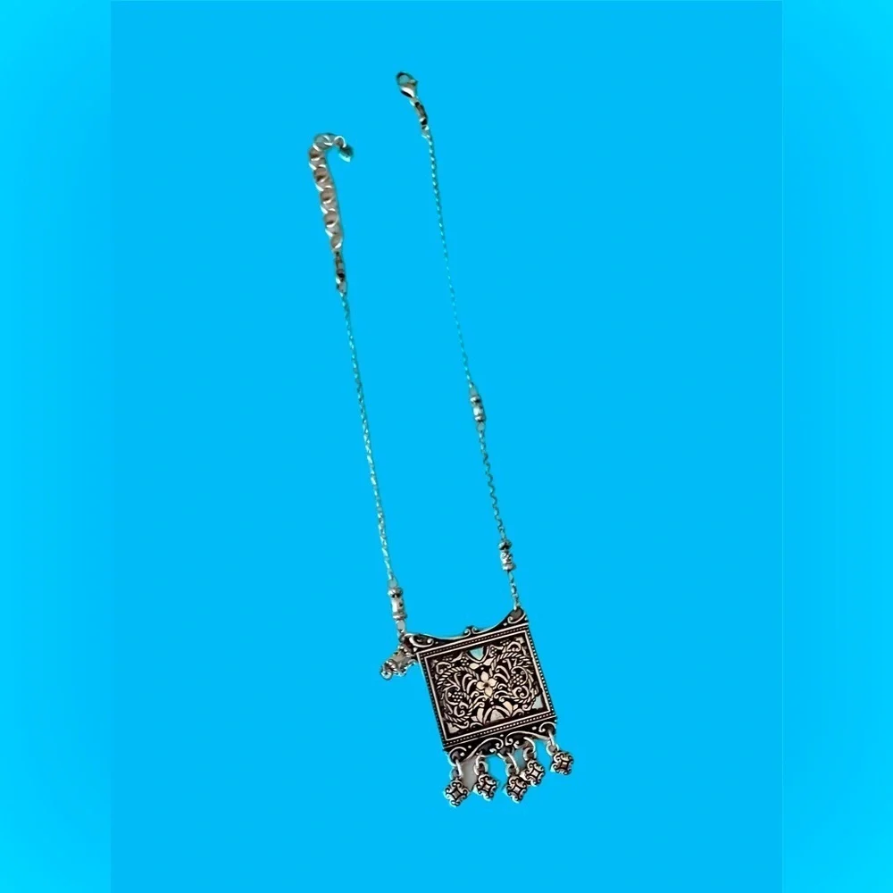 Brighton pendant necklace. Square pendant with loose charms. 10